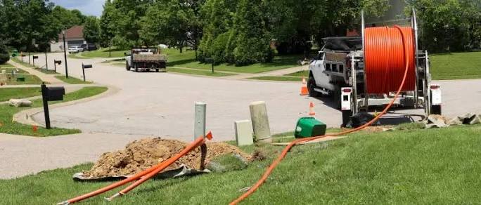 Fibre optic cable trenching and installation crew on site